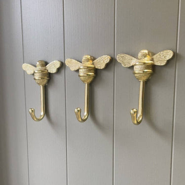 Bee coat hook iron | Polished brass | 10.4 x 4.4 x 13.3 cm | Bee